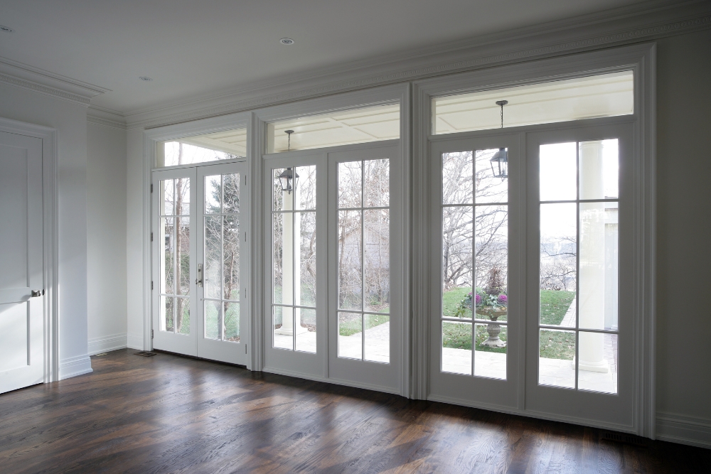 French doors with upgraded security features, featuring multiple panes and a secure locking mechanism.