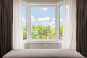 Bright room with a view through a uPVC casement window, showcasing outdoor greenery and emphasising casement window benefits.